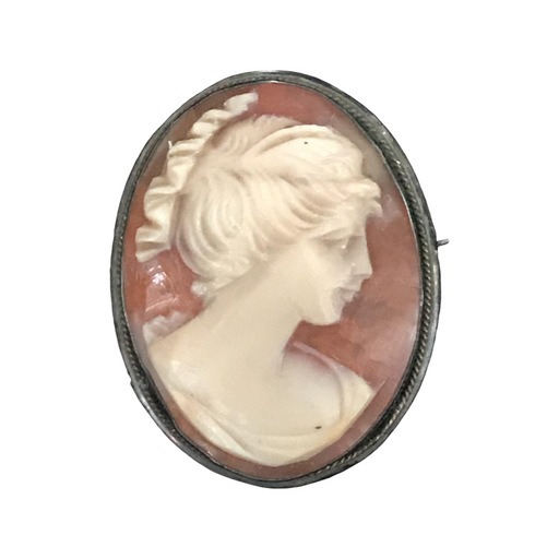 Antique pin with a portrait of a woman 