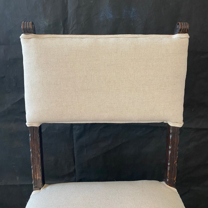 Antique carved wooden chair with new upholstery 