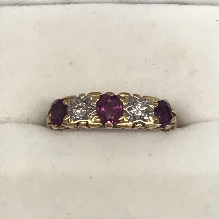 Vintage ruby and diamond gold band engagement ring