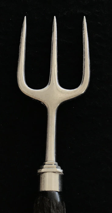 Antique silver serving fork with an antler handle