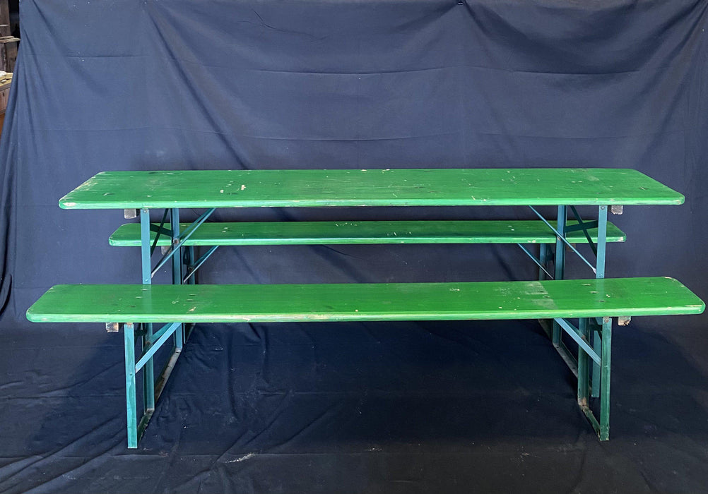 Picnic style green painted wood folding table with two benches