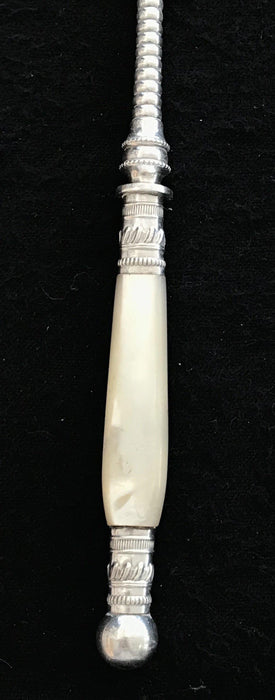 Antique silver bread fork with a mother of pearl handle