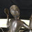 Antique bronze sculpture of a lady holding a mirror 