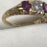 Vintage ruby and diamond gold band engagement ring