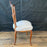 Antique pair of carved wooden side chairs with upholstered seat cushions 