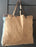 Vintage tote bag with exterior pocket made from repurposed materials 
