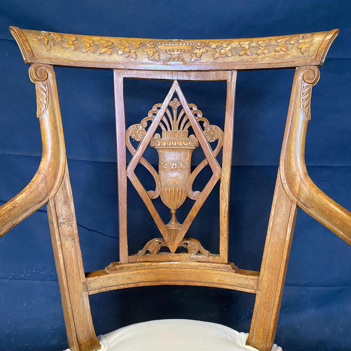 Set of Four 19th Century French Walnut Intricately Carved Neoclassical Arm Chairs
