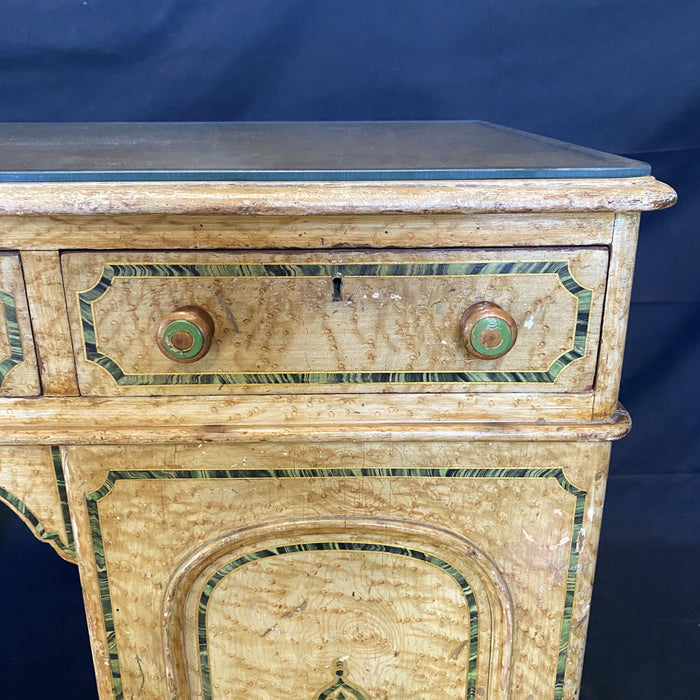 Antique faux painted desk with a glass top 