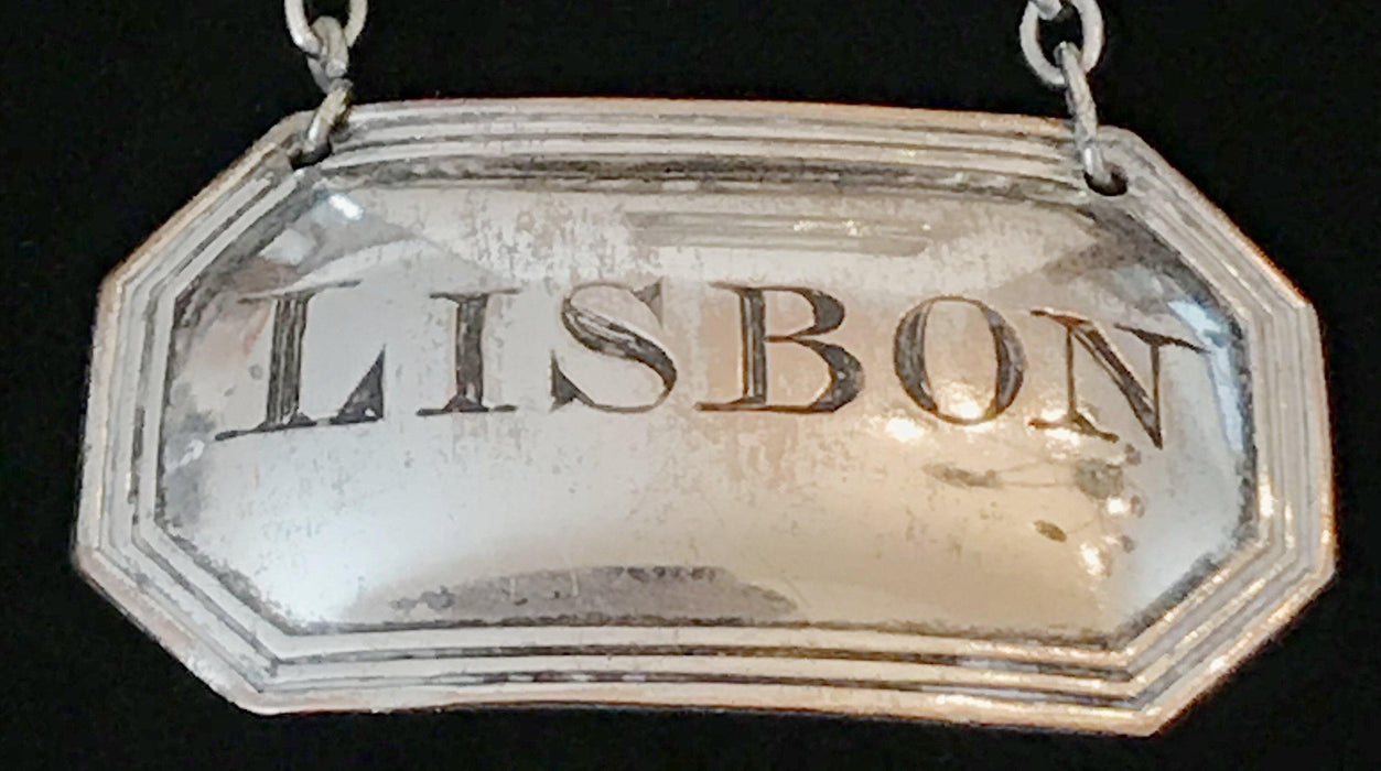 Antique wine or liquor silver label with Lisbon etched on the center 