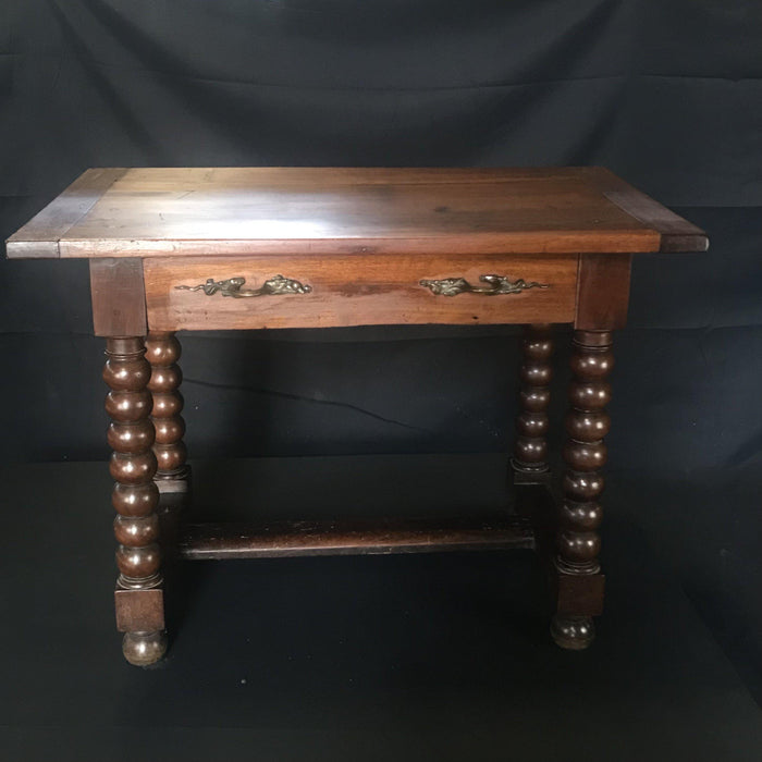 Antique dark walnut table with drawer and turned legs 