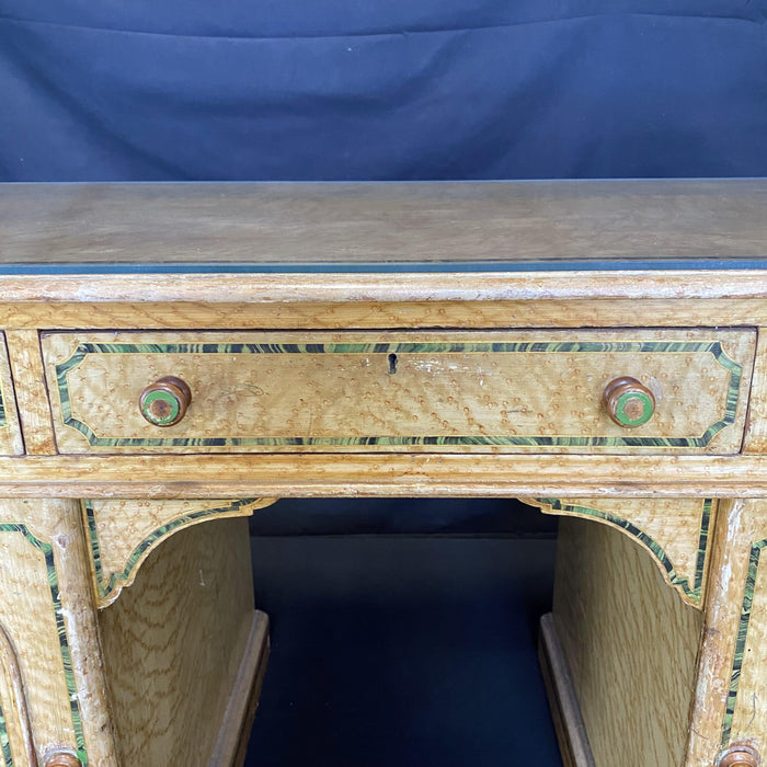 Antique faux painted desk with a glass top 