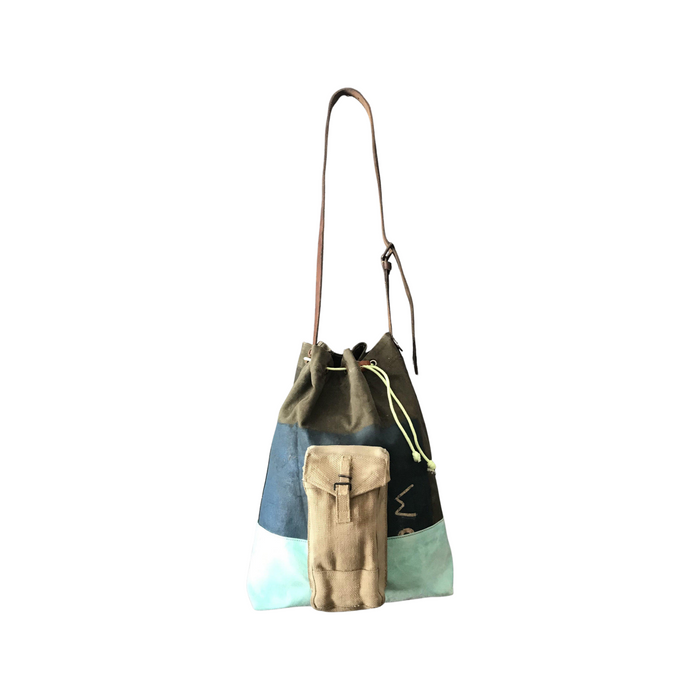Vintage green and blue striped shoulder bag with an ammo pocket on the outside and a leather strap