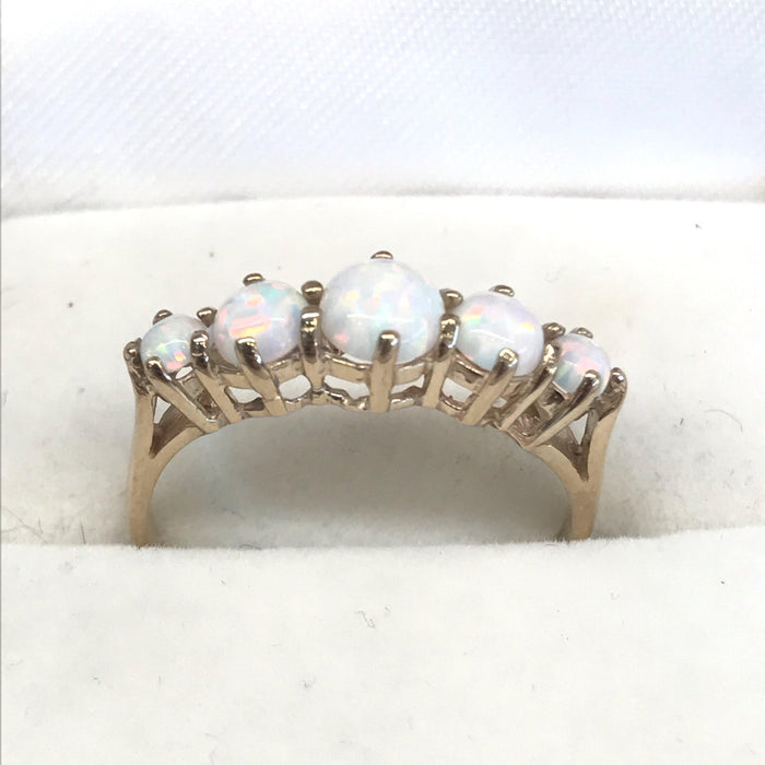 Vintage engagement ring with gold band and opals 