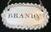 Antique silver brandy liquor label 