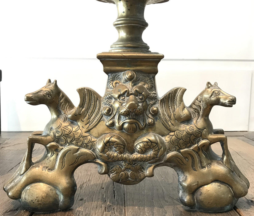 Antique brass andirons with lion and horse details 