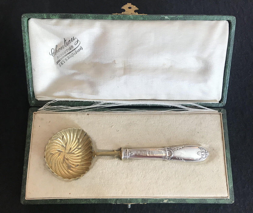 Antique gold and silver spoon in a box