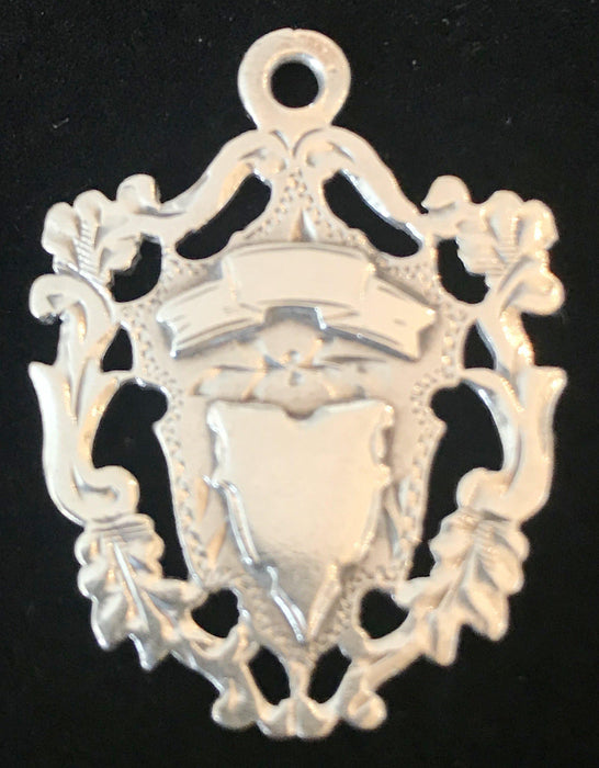 Antique silver medal pendant with crest 