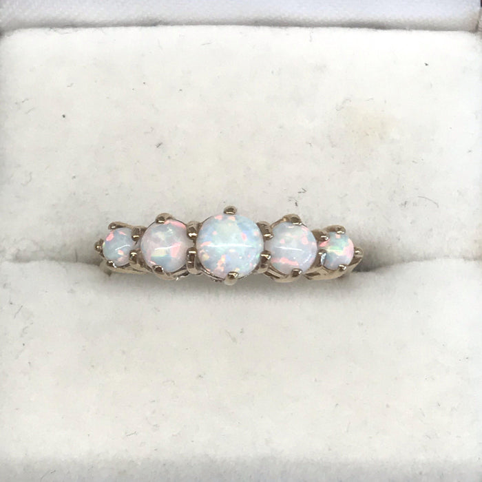 Vintage engagement ring with gold band and opals 