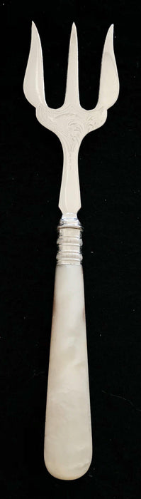 Antique silver bread fork with mother of pearl handle