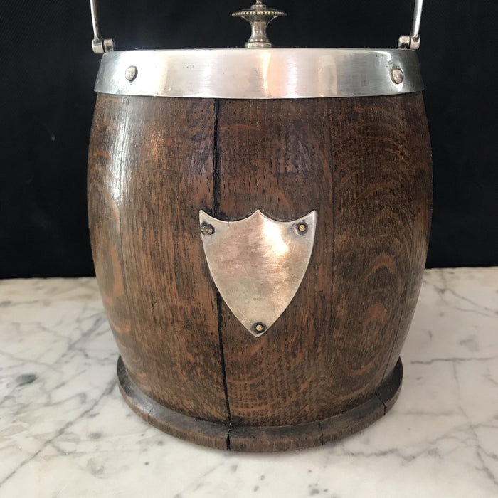 Antique oak biscuit barrel or ice bucket with silver details 