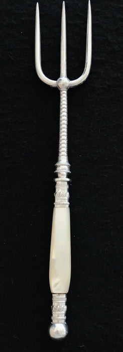 Antique silver bread fork with a mother of pearl handle