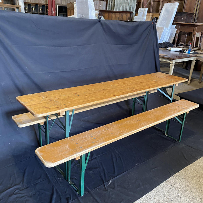 Picnic style brown folding table with two folding benches