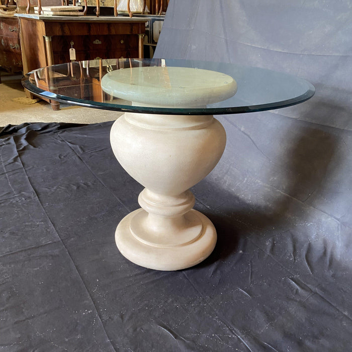 Antique indoor or outdoor table with stone center base and a glass top