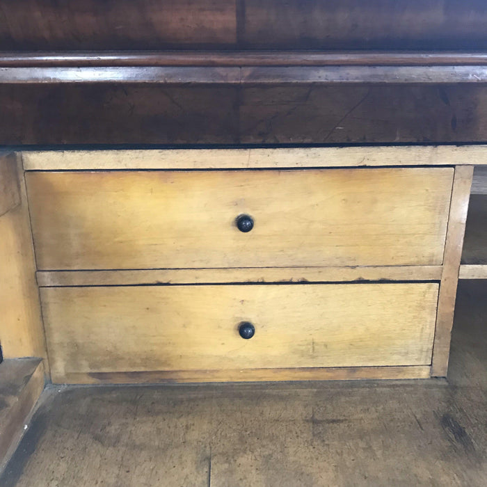 Antique dark wood four drawer set of drawers with brass hardware