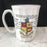 Antique white mug with gold rim and coat of arms design 