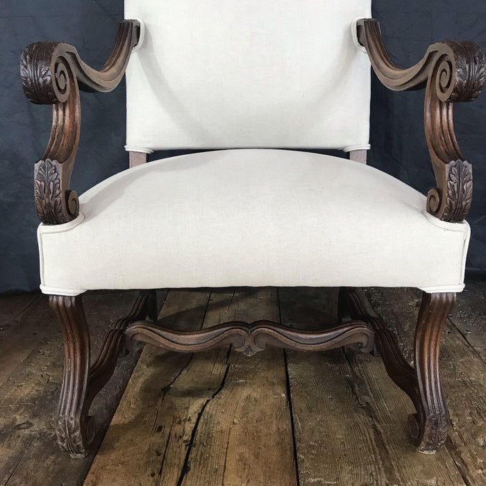 Antique carved armchair with new upholstery
