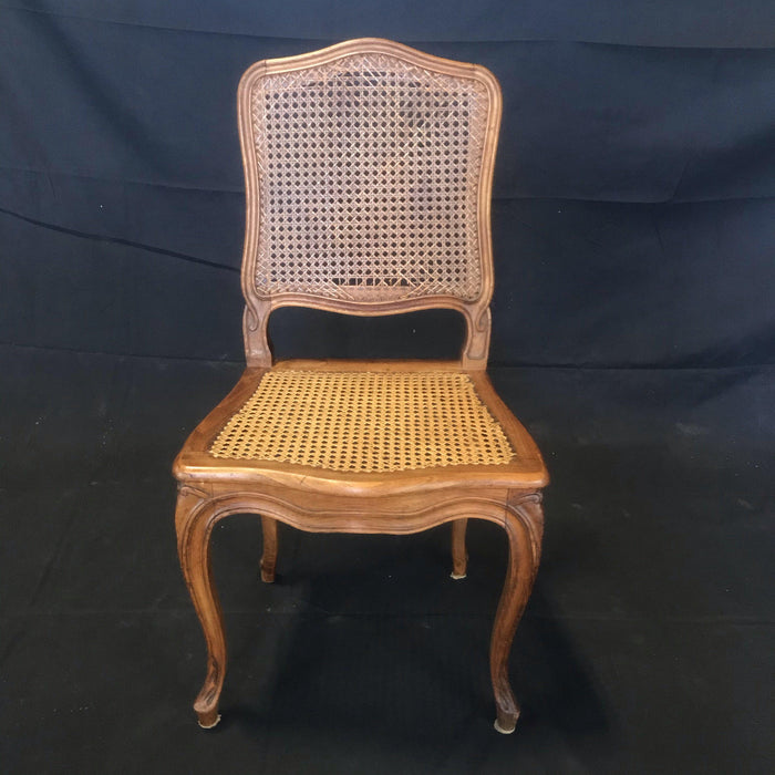 Set of Four French Walnut Carved Cane Dining Chairs