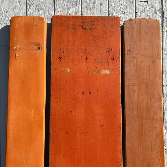 Picnic style orange painted wood folding table with two benches 