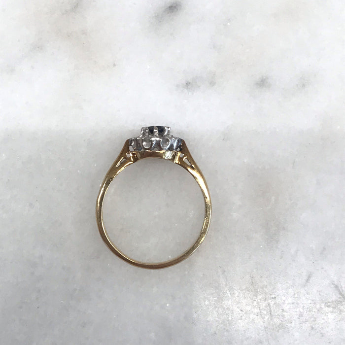 Vintage gold band engagement ring with sapphire and diamonds 