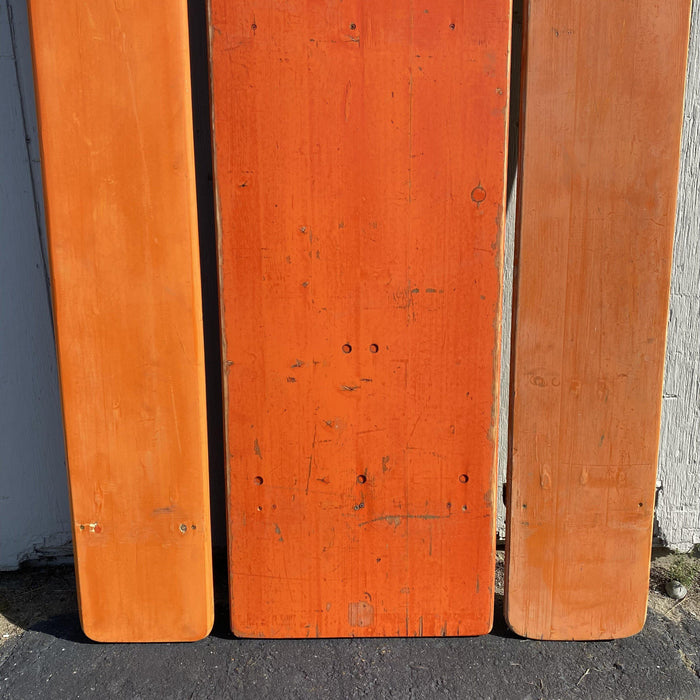 Picnic style orange painted wood folding table with two benches 