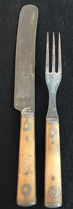 Antique silver fork and knife set with a bone handle