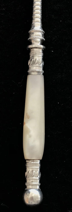 Antique silver bread fork with a mother of pearl handle