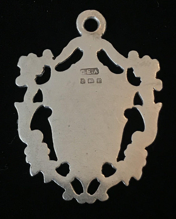 Antique silver medal pendant with crest 