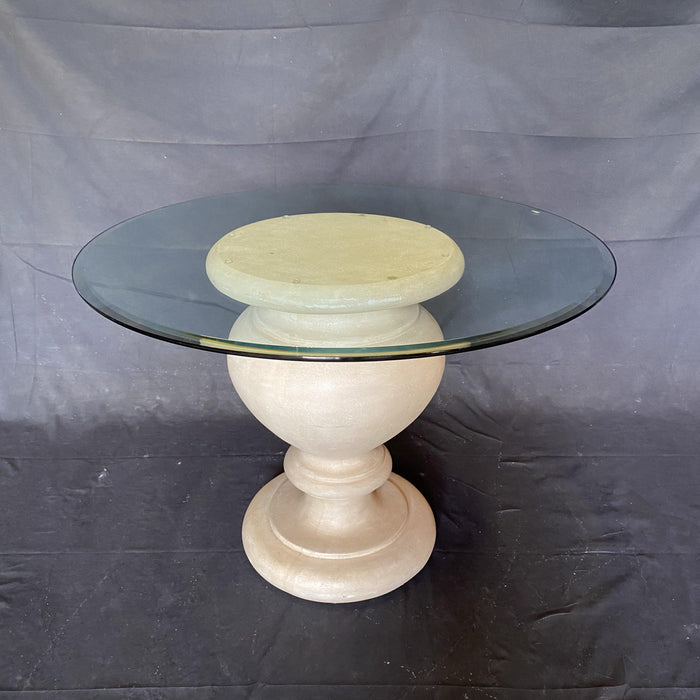 Antique indoor or outdoor table with stone center base and a glass top