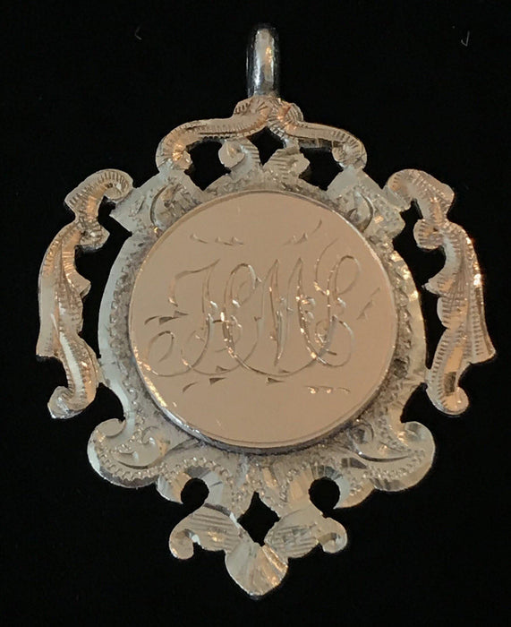 Antique gold medal pendant with monogram