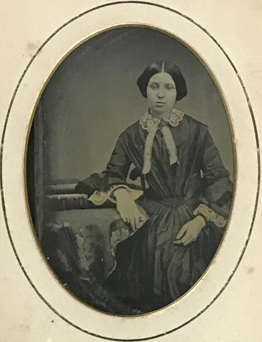 Antique photo of a woman in a gold frame 