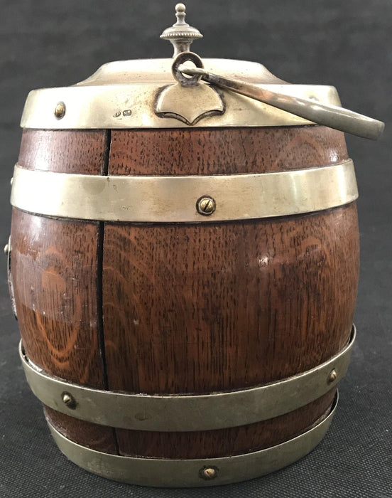 Antique oak biscuit barrel with silver banding and handle 