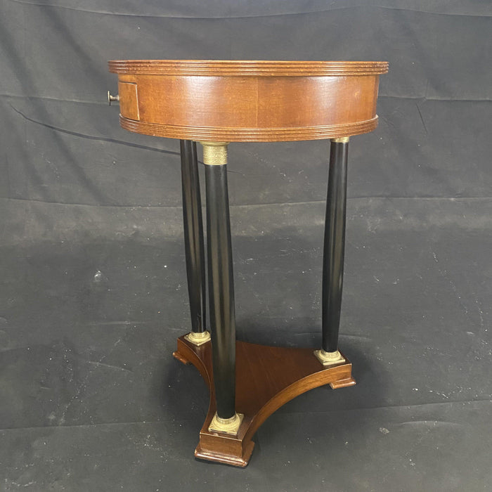 Antique walnut round nightstand or side table with ebony legs and bronze details 