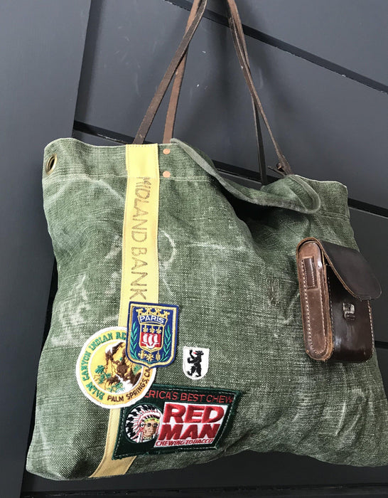 Vintage green tote bag with patches and leather handles