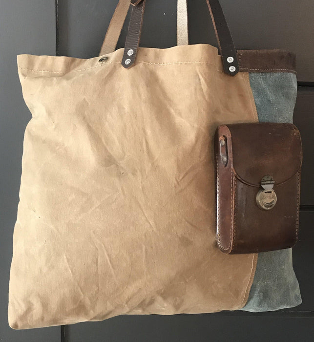Vintage tote bag with exterior pocket made from repurposed materials 