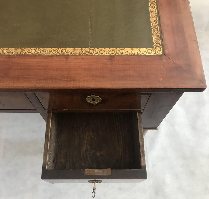 Antique French empire style desk with a leather top