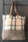 Wool tote bag with leather straps and a pocket on the outside