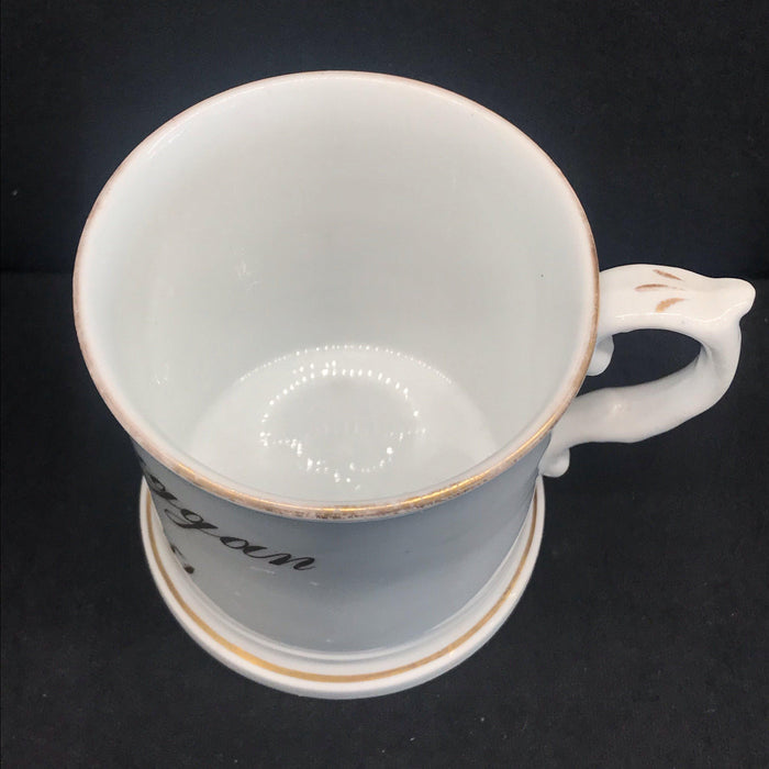 Antique white porcelain mug with gold writing