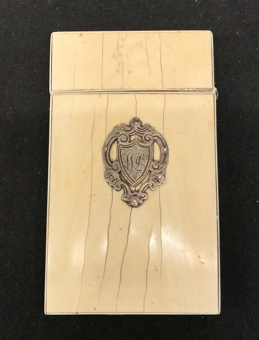 Antique card case with a silver crest 