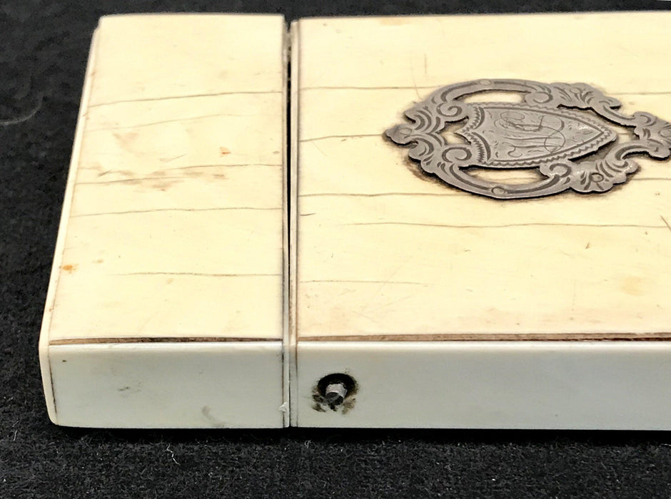 Antique card case with a silver crest 